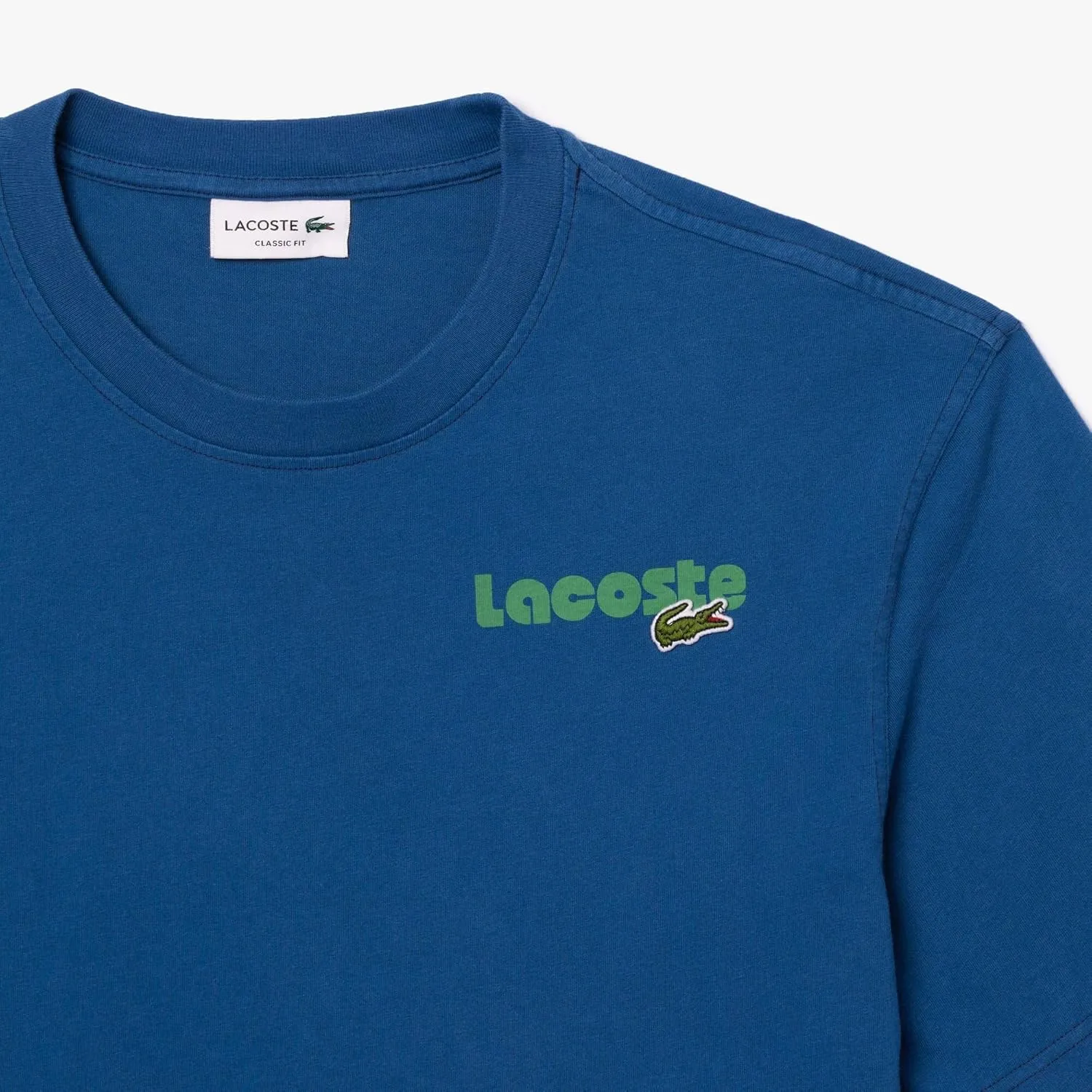 Lacoste Men's Short Sleeve Classic Fit Tee Shirt W Wording on Back